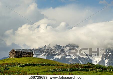 Barn on hill and distant mountains, Mazeri village, Svaneti, Georgia View Large Photo Image Stock Image - Barn on hill and distant mountains, Mazeri village, Svaneti, Georgia. Fotosearch