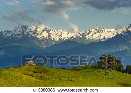 Barn on hill and distant snow capped mountains, Mazeri village, Svaneti, Georgia View Large Photo Image Stock Photograph - Barn on hill and distant snow capped mountains, Mazeri village, Svaneti, Georgia. Fotosearch