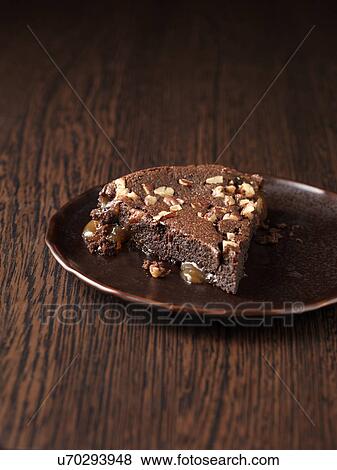 Belgian chocolate and salted caramel pecan torte View Large Photo Image Stock Photo - Belgian chocolate and salted caramel pecan torte. Fotosearch