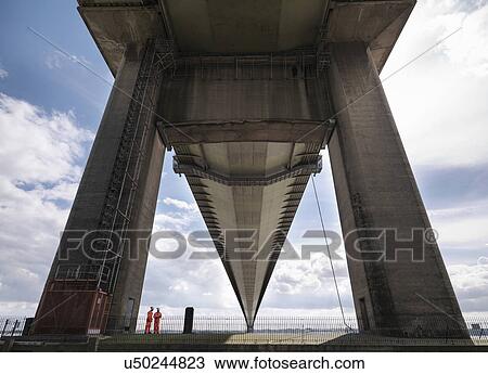 Bridge workers inspecting suspension bridge. The Humber Bridge, UK was built in 1981 and at the time was the world's largest single-span suspension bridge View Large Photo Image Stock Image - Bridge workers inspecting suspension bridge. The Humber Bridge, UK was built in 1981 and at the time was the world's largest single-span suspension bridge. Fotosearch