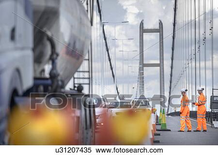 Bridge workers inspecting traffic on suspension bridge. The Humber Bridge, UK was built in 1981 and at the time was the world's largest single-span suspension bridge View Large Photo Image Stock Photography - Bridge workers inspecting traffic on suspension bridge. The Humber Bridge, UK was built in 1981 and at the time was the world's largest single-span suspension bridge. Fotosearch