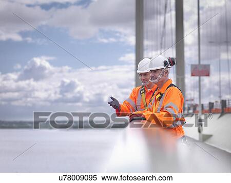 Bridge workers on parapet of suspension bridge. The Humber Bridge, UK was built in 1981 and at the time was the world's largest single-span suspension bridge View Large Photo Image Stock Photography - Bridge workers on parapet of suspension bridge. The Humber Bridge, UK was built in 1981 and at the time was the world's largest single-span suspension bridge. Fotosearch