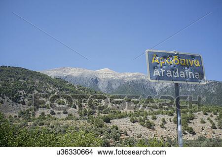 Picture - Bullet ridden sign, Aradaina, Crete. Fotosearch