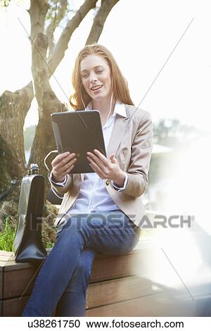 Business woman using digital tablet View Large Photo Image Stock Image - Business woman using digital tablet. Fotosearch