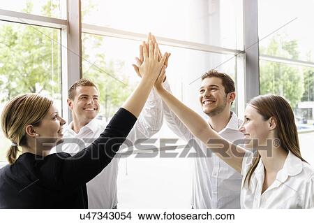 Picture - Businessmen and businesswomen cheering. Fotosearch