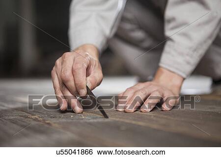 Carpenter checking quality of wood plank in factory, Jiangsu, China View Large Photo Image Stock Photograph - Carpenter checking quality of wood plank in factory, Jiangsu, China. Fotosearch
