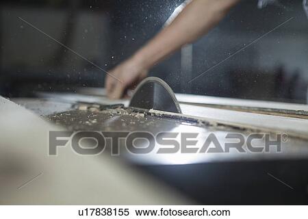 Carpenter cutting wood plank with electric saw in factory, Jiangsu, China View Large Photo Image Stock Photography - Carpenter cutting wood plank with electric saw in factory, Jiangsu, China. Fotosearch