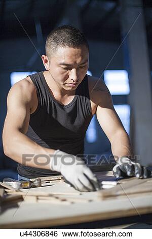 Carpenter piecing together wood blocks in factory, Jiangsu, China View Large Photo Image Stock Photograph - Carpenter piecing together wood blocks in factory, Jiangsu, China. Fotosearch