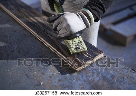 Carpenter working on wood plank in factory, Jiangsu, China View Large Photo Image Stock Photo - Carpenter working on wood plank in factory, Jiangsu, China. Fotosearch