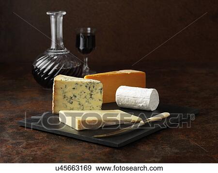 Stock Photo - Cheese board with red wine. Fotosearch