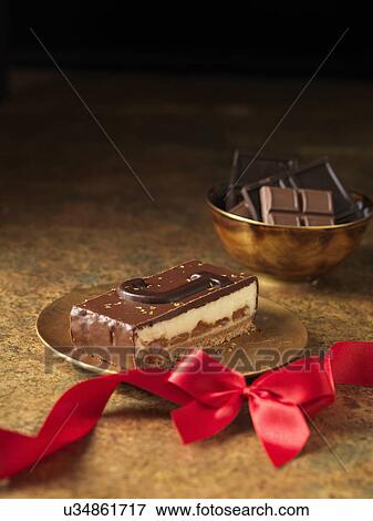 Stock Photo - Chocolate dessert slice with letter J. Fotosearch