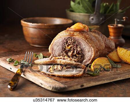 Christmas dinner. Free range boneless duck with pork, cranberry & morello cherry stuffing, apricots, oranges, sage and bay leaves View Large Photo Image Stock Photo - Christmas dinner. Free range boneless duck with pork, cranberry & morello cherry stuffing, apricots, oranges, sage and bay leaves. Fotosearch