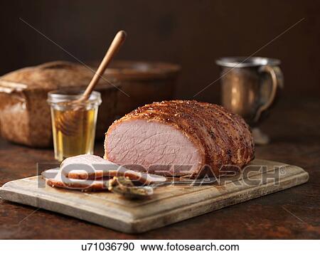 Christmas dinner. Honey and wholegrain mustard gammon on chopping board View Large Photo Image Stock Image - Christmas dinner. Honey and wholegrain mustard gammon on chopping board. Fotosearch