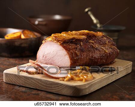 Christmas dinner. Orange marmalade gammon on wooden chopping board View Large Photo Image Stock Image - Christmas dinner. Orange marmalade gammon on wooden chopping board. Fotosearch