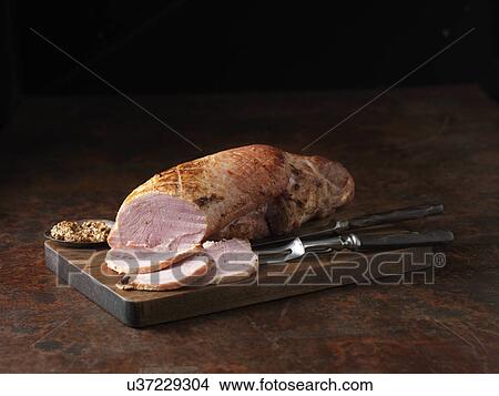Christmas dinner. Outdoor Wiltshire ham roasted on the bone with wholegrain mustard View Large Photo Image Picture - Christmas dinner. Outdoor Wiltshire ham roasted on the bone with wholegrain mustard. Fotosearch