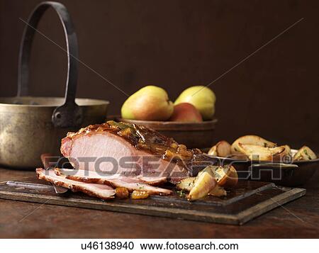 Christmas dinner. Roasted pear and muscavado sugar cured loin with potatoes, apples and herbs View Large Photo Image Stock Image - Christmas dinner. Roasted pear and muscavado sugar cured loin with potatoes, apples and herbs. Fotosearch