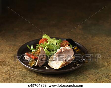 Christmas snack of Brussels pate with red chillies, rocket and mixed green lettuce leaves, cherry tomatoes View Large Photo Image Stock Image - Christmas snack of Brussels pate with red chillies, rocket and mixed green lettuce leaves, cherry tomatoes. Fotosearch