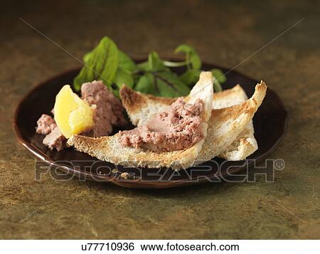 Christmas snack of chicken liver parfait with calvados. Green salad leaves and white bread toasted crumbs View Large Photo Image Stock Photograph - Christmas snack of chicken liver parfait with calvados. Green salad leaves and white bread toasted crumbs. Fotosearch
