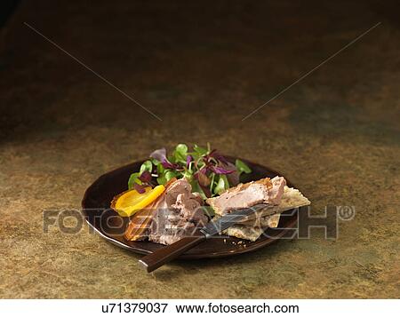 Christmas snack of duck liver pate with truffles. Mixed salad leaves and orange slices View Large Photo Image Stock Photo - Christmas snack of duck liver pate with truffles. Mixed salad leaves and orange slices. Fotosearch