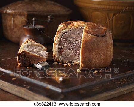 Christmas snack of game pie on chopping board View Large Photo Image Stock Image - Christmas snack of game pie on chopping board. Fotosearch