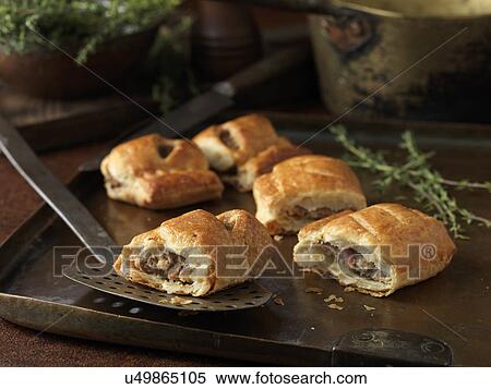 Christmas snack of gourmet sausage rolls and thyme leaves View Large Photo Image Stock Photography - Christmas snack of gourmet sausage rolls and thyme leaves. Fotosearch