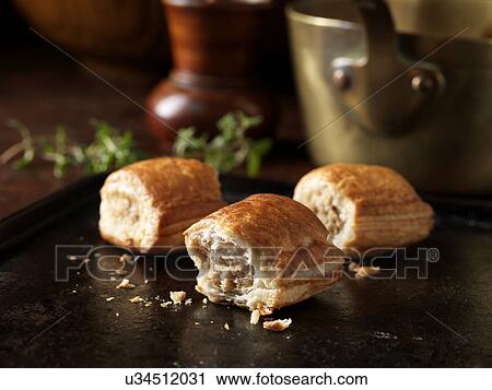 Christmas snack of outdoor bred mini sausage rolls and thyme leaves View Large Photo Image Stock Image - Christmas snack of outdoor bred mini sausage rolls and thyme leaves. Fotosearch