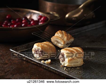 Christmas snack with pork & cranberry sausage rolls on roasting tray View Large Photo Image Stock Photograph - Christmas snack with pork & cranberry sausage rolls on roasting tray. Fotosearch