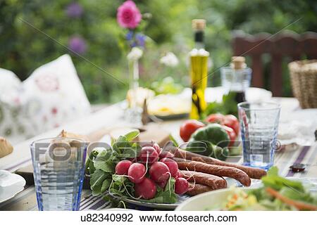 Stock Image - Close up of fresh vegetables on table. Fotosearch