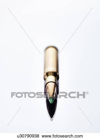 Stock Photo - Close up of golden bullet. Fotosearch