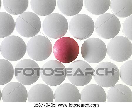 Close up of white pills and one red pill View Large Photo Image Stock Photography - Close up of white pills and one red pill. Fotosearch