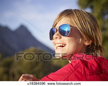 Close up portrait of boy in landscape, Majorca, Spain View Large Photo Image Stock Photograph - Close up portrait of boy in landscape, Majorca, Spain. Fotosearch