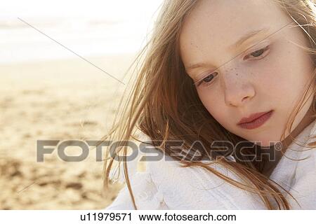Close up portrait of girl wrapped in blanket on beach View Large Photo Image Stock Image - Close up portrait of girl wrapped in blanket on beach. Fotosearch