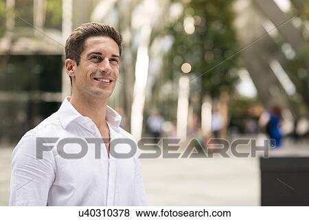 Stock Photo - Confident young businessman at Broadgate Tower, London, UK. Fotosearch