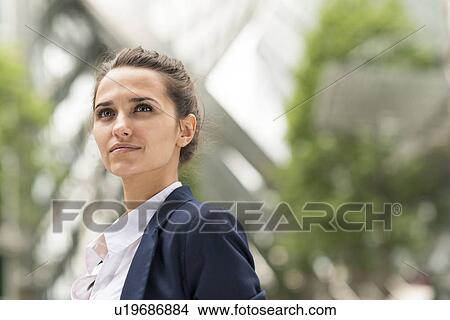 Confident young businesswoman at Broadgate Tower, London, UK View Large Photo Image Picture - Confident young businesswoman at Broadgate Tower, London, UK. Fotosearch