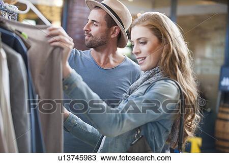 Couple shopping for clothes View Large Photo Image Stock Image - Couple shopping for clothes. Fotosearch