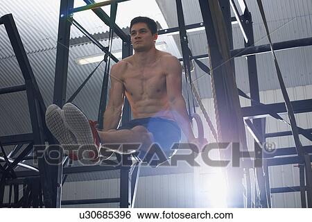 Crossfitter working out in gym View Large Photo Image Stock Photograph - Crossfitter working out in gym. Fotosearch