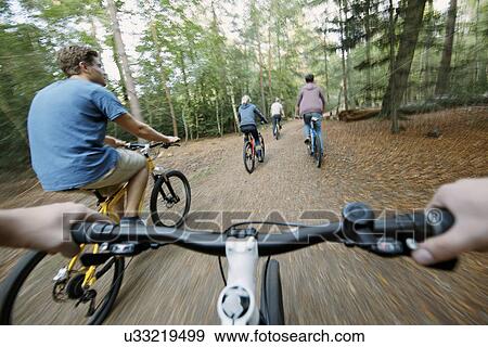 Stock Photo - Cycling in the woods. Fotosearch