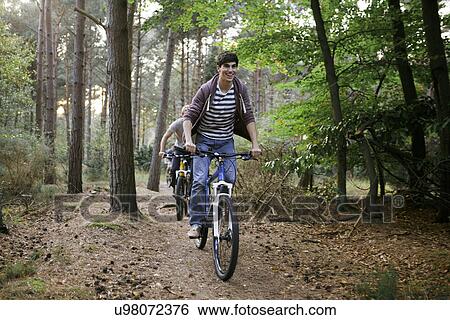 Cycling in the woods View Large Photo Image Stock Photograph - Cycling in the woods. Fotosearch
