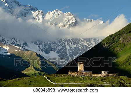Stock Photo - Distant view of old ruined Svanetian towers in valley, Ushguli village, Svaneti, Georgia. Fotosearch