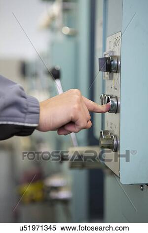 Factory worker at control panel of machinery View Large Photo Image Stock Photography - Factory worker at control panel of machinery. Fotosearch