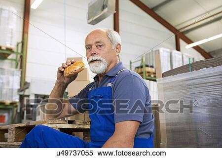 Factory worker taking break View Large Photo Image Stock Photography - Factory worker taking break. Fotosearch