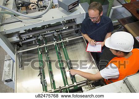 Stock Photo - Factory worker with supervisor. Fotosearch