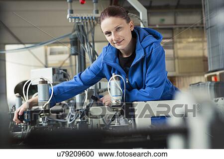 Factory worker working machinery View Large Photo Image Stock Image - Factory worker working machinery. Fotosearch