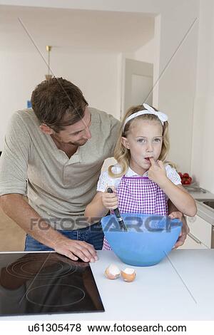 Father and daughter baking View Large Photo Image Stock Photo - Father and daughter baking. Fotosearch