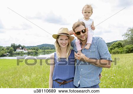 Father and mother, baby on father's shoulders View Large Photo Image Stock Photo - Father and mother, baby on father's shoulders. Fotosearch