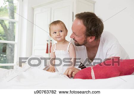 Father with baby daughter View Large Photo Image Stock Image - Father with baby daughter. Fotosearch
