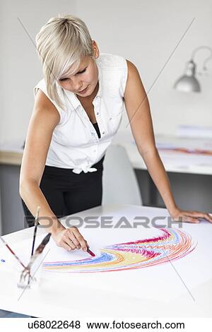 Female artist drawing View Large Photo Image Stock Photo - Female artist drawing. Fotosearch