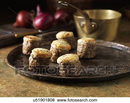 Stock Photo - Festive Christmas ingredients of pork & wild mushroom stuffing with stilton & red onion. Fotosearch