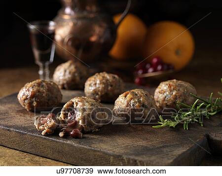 Festive Christmas ingredients of pork, orange, rosemary stuffing balls with port and cranberry sauce centres. Oranges and a glass of red wine View Large Photo Image Stock Photo - Festive Christmas ingredients of pork, orange, rosemary stuffing balls with port and cranberry sauce centres. Oranges and a glass of red wine. Fotosearch