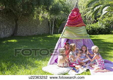 Five girls playing clapping games in front of teepee View Large Photo Image Stock Image - Five girls playing clapping games in front of teepee. Fotosearch